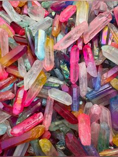 many different colored crystals are scattered together