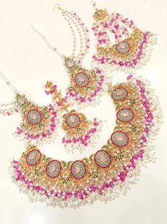 Most beautiful designer bridal set. Full complete set.   Earrings  Necklace Tikka Jhoomer Wedding Sets With Stone Work In Multicolor, Multicolor Wedding Sets With Stone Work, Multicolor Wedding Set With Stone Work, Heavy Multicolor Wedding Sets, Heavy Multicolor Bridal Sets For Wedding, Heavy Multicolor Bridal Necklace For Wedding, Multicolor Bridal Necklace With Intricate Design For Wedding, Multicolor Bridal Necklace With Stone Work For Wedding, Multicolor Lehenga With Stone Work For Wedding