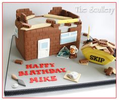 a birthday cake that is made to look like a brick house