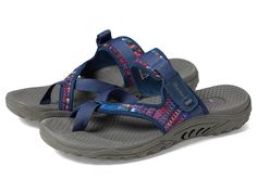 SKECHERS Reggae - Mad Swag - Women's Sandals : Navy : Have some fun with your warm-weather look in the colorful SKECHERS Reggae - Mad Swag sandal. Nylon fabric upper features a woven finish and multi-color textile panel. Slip-on construction. Open-toe silhouette with toe ring detail. Strap over instep with adjustable hook-and-loop closure for a secure fit. Breathable fabric strap lining. Contoured footbed flaunts arch support and toe ridge for added comfort. Flexible rubber traction outsole. Imported. Measurements: Weight: 7 oz Product measurements were taken using size 8, width B - Medium. Please note that measurements may vary by size. Weight of footwear is based on a single item, not a pair. Swag Women, Sketchers Sandals, Skechers Shoes Women, Toe Ring, Skechers Women, Nylon Fabric, Skechers Shoes, Toe Rings, Personal Shopping