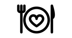 a plate with a heart on it next to a fork and knife