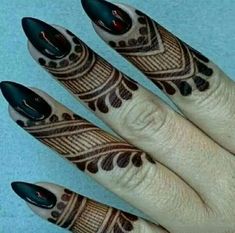 a woman's hand with black and white designs on it