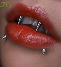 a woman's lips with spikes on them