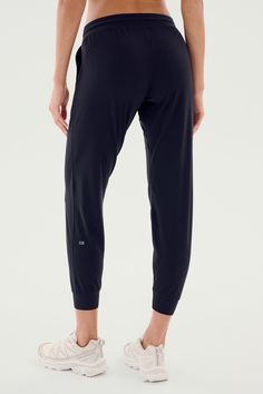 Our classic relaxed fit jogger in a new updated fit. Super soft Airweight fabric, designed for maximum versatility. BEST FOR: any workout or for casual wear. Model is 5'10" and wears a size small. Black Breathable 4-way Stretch Pants, Black 4-way Stretch Yoga Pants For Jogging, Black Running Bottoms With 4-way Stretch, Black Activewear With Elastic Waistband And Athletic Fit, Black Athleisure Bottoms With 4-way Stretch, Black Go-dry Athleisure Bottoms, Black Midweight Activewear For Gym, Casual Black Yoga Pants With Comfort Stretch, Comfortable Black Stretch Pants