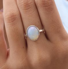 Ethiopian Opal Ring - 925 Solid Sterling Silver Ring - October Birthstone - Boho Handmade Ring - Natural Gemstone Jewellery - Gift For Her   Gemstone Name - Ethiopian Opal Gemstone . Stone Quality - AAA. Ring Weight -  3.66 g  Length  - 1.5 cm Width -  1.1 cm Stone Shape - as Shown In The Picture. Ring Size - All Ring Size Available .  All Our Jewelry is Stamped 925  We serve complete 925 sterling silver Jewelry and genuine properties of the stone, Our all products are stamped 925. Product Quality and Packaging - Our all products are 925 Silver Stamped which shows that the product is genuine and authentic .The products are dispatched from the small business from UK so you get the product on time and the product packaging comes in bubble foil wrap with all the precautions taken primarily th Picture Ring, Ethiopian Opal Ring, Boho Handmade, Natural Gemstone Jewelry, Gemstone Jewellery, Jewellery Gift, October Birthstone, Opal Ring, Handmade Boho