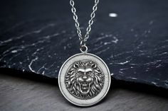 🦁👑 Lion Medallion Necklace - Channel the Majesty of the King of the Jungle! 👑🦁 Unleash your inner strength with our Lion Medallion Necklace--a regal silver-plated pendant capturing the essence of the majestic lion, king of the jungle. This isn't just jewelry; it's a symbol--an accessory for wildlife lovers and a reminder of the untamed power and courage embodied by the noble lion. ✨ Key Features: Silver-plated Lion Medallion pendant, symbolizing strength and courage Unisex and adjustable, pe Lion King Of The Jungle, Majestic Lion, Symbol Of Strength, King Of The Jungle, Symbols Of Strength, Medallion Necklace, Leo Zodiac, The Untamed, Inner Strength