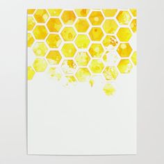 a piece of paper with yellow and orange hexagonals on the top, in front of a white background