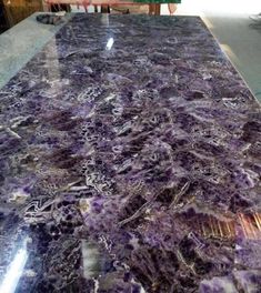 a counter top that has purple marble on it