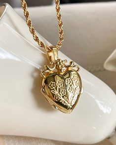 The Mon Amour Locket, my love locket is a beautiful locket you can keep your treasures close to the heart. Gold plated silver functioning heart locket measuring 25mm x20mm x6.7mm. You can adhere photos or leave a secret message . Gold plated brass rope chain 2.5mm thick and 16-18 inches in length . Heart Shape Locket Gold, Keepsake Heart Pendant Necklace With Locket, Heart Pendant Locket Necklace For Wedding, Wedding Heart Medallion Locket Necklace, Heart Charm Pendant Locket Necklace As Keepsake, Wedding Heart Pendant Locket Necklace With Charms, Heart Charm Medallion Locket Necklace As Gift, Heart Medallion Necklace With Locket For Gifts, Heart Medallion Locket Necklace As Gift