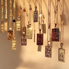 there are many necklaces hanging on the wall