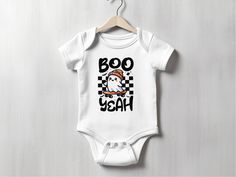 This adorable Ghost Halloween Baby Bodysuit features a cute skater ghost wearing a hat with the text "Boo Yeah", making it perfect for your little one's spooky celebrations. This baby outfit is ideal for Halloween parties, newborn photo shoots, and baby showers. Make this baby gift even more special by adding the name of your little one! 👕 I T E M   I N F O: RABBIT SKINS 4400 ◦ Colors: Solid colors are 100% super soft, combed, ringspun cotton. Heather colors are 90% cotton and 10% polyester. ◦ White Halloween Onesie In Casual Style, Casual White Onesie For Halloween, White Casual Onesie For Halloween, White Casual Halloween Onesie, Cute White Halloween Onesie, Halloween Baby Clothes, Halloween Romper, Baby Halloween Outfits, Skateboard Clothes