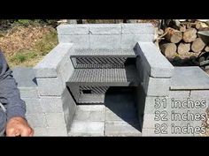 a man standing in front of a fire pit made out of cinder blocks and bricks