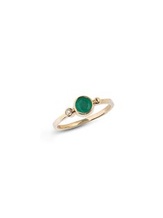 A round Emerald is delicately bezel set in a gold hammered band, along with a bezel set diamond and gold Dew Drop detail.This dainty everyday ring can be worn as a stackable set or on its own. Size: 7 Emerald Gemstone measures 5mm Diamond carat weight 0.03 14k yellow Gold Looking for a different ring size? Contact us at hello@meusshop.com Designed by Anzie May Birthstone Diamond Ring With Bezel Setting, Emerald Ring With Bezel Setting, Fine Jewelry Stackable Rings With Bezel Setting, Fine Jewelry Bezel Setting Ring For May Birthstone, Fine Jewelry Bezel Set Ring With May Birthstone, Fine Jewelry 14k Gold Stackable Rings With Bezel Setting, 14k Gold Stackable Rings With Bezel Setting, 14k Gold Rings With Bezel Setting, Everyday Stackable Rings With Bezel Setting