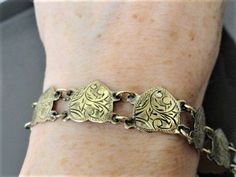 "Beautiful vintage heart bracelet with lovely etched design. Gold over sterling silver. Faintly marked .925 on clasp. Links measure 1/2\" Bracelet measures 6 1/2\" Weighs 13.9 grams All items are gift boxed ready for giving. If sending directly to someone as a gift I am happy to enclose a card with your personal message at no additional cost. I have many beautiful period antique pieces in my shop. Please consider browsing and don't hesitate to contact me if you have any questions or would like f Adjustable Victorian Bracelet For Anniversary, Vintage Nickel-free Heart Bracelet As Gift, Nickel-free Vintage Heart Bracelet As Gift, Vintage Nickel-free Heart Bracelet Gift, Valentine's Day Vintage Etched Jewelry, Ornate Stamped Bracelets For Gift, Vintage Heart Bracelets For Formal Occasions, Adjustable Metal Heart Bracelet For Formal Occasions, Elegant Stamped Heart-shaped Jewelry