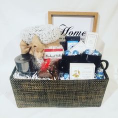 a basket filled with lots of items sitting next to a sign and a wooden frame