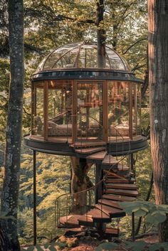 a tree house in the woods with stairs leading up to it's top floor