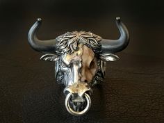 🔱 Embrace the strength, power, and spiritual guidance of the Hell Bull ring. Rise up to any challenge with this extraordinary piece of jewelry loaded with unapologetic Mortis Ores DNA and created with meticulous craftmanship. Designed to honor the fight through any obstacles, this Hell Bull ring will give you the bullish spirit to rise and win it head on. Make it a symbol of your strength and wear it as a statement! 🔱 The ring weighs at approximately 75 grams of 925 sterling silver with 22K go