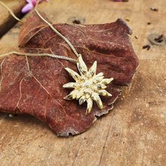 Edelweiss flower pendant in 14k yellow Solid gold Beautiful and realistic edelweiss flower pendant, Hand made in the unique and wonderful technique of Tar repousse , made to look as realistic and elegant as the real flower with attention to the smallest details. Great addition for your charm collection or stacking with several chains , or as a stand alone pendant. The edelweiss is a mountain flower, name comes from german language and means "nobel" :) beautiful gift with meaning to give to your Edelweiss Necklace, Edelweiss Flower, Charm Collection, Solid Gold Necklace, Gold Alloys, With Meaning, Handmade Jewelry Designs, German Language, Flower Pendant