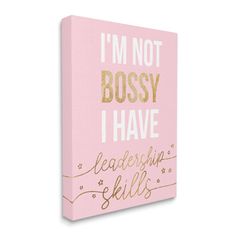 a pink and gold canvas with the words i'm not bossy i have