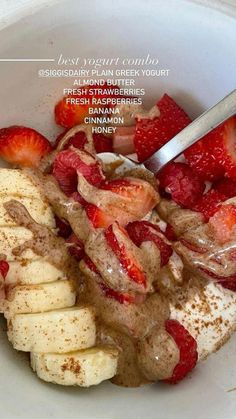 a bowl filled with bananas and strawberries