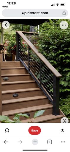 an image of a wooden deck with metal railings and handrails on it