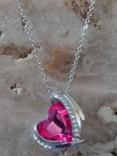 This is a beautiful 925 silver plated chain with Magenta Pink crystal gemstone. Meet Aqueila! She is a Syrah Djinn Grim reaper and looks very similar to the photo. She is very beautiful compassionate to her keeper. She can help with communicating with the deceased as she is the gatekeeper of the spirit realm and serves as a spirit guide to her keep her with guidance on developing your spiritual gifts and abilities. She's very active and loves offerings of cemetary dirt, silver objects, red gemst Valentine's Day Silver Chain Pendant Necklace, Crystal Heart Pendant Jewelry For Her, Crystal Heart Pendant Jewelry Gift For Her, Sparkling Stone Necklaces For Valentine's Day Gift, Valentine's Day Necklaces With Sparkling Stones As Gifts, Valentine's Day Necklace With Sparkling Stones, Silver Crystal Heart Pendant Jewelry, Silver Heart Crystal Necklace, Silver Heart-shaped Crystal Jewelry