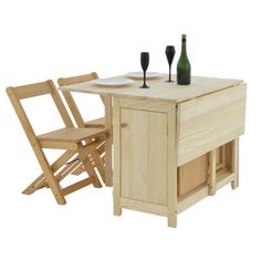 a wooden table with two chairs and a wine bottle