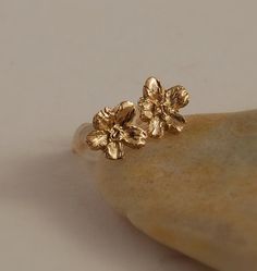 Detailed little 5 pedal blossom in a 14K gold post earrings. 1/4 across Yellow gold in stock now.  A great stud earring for someone who just likes Delicate Gold Earrings With 3d Flowers, Gold Flower Cluster Earrings For Pierced Ears, Rose Gold Flower Earrings In 14k Gold, Dainty Gold Jewelry With 3d Flowers, 14k Rose Gold Flower Earrings, Gold Flower Cluster Earrings Gift, Delicate Tiny Gold Flower Earrings, Gold Jewelry With 3d Flowers For Jewelry Making, 14k Gold Flower Earrings For Gift