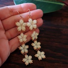 Elegant White Beaded Chain Earrings, Delicate White Jewelry With Dangling Beads, Rose Gold Beaded Dangle Jewelry, White Flower-shaped Jewelry With Dangling Beads, Beige Jewelry With Dangling Beads As Gift, Beige Jewelry With Dangling Beads For Gift, Delicate Handmade Cream Jewelry, Handmade Delicate Cream Jewelry, Cream Beaded Dangle Jewelry