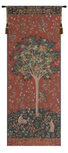 a tapestry hanging from the side of a wall with an animal and tree on it