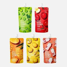 four different flavors of fruit juice in plastic bags