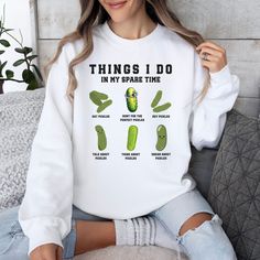 "🥒 Embrace Your Pickle Passion with Style! 🥒 Introducing our exclusive \"Pickles Lover\" sweatshirt, the perfect blend of comfort and quirky charm for anyone obsessed with the tangy delight of pickles! Whether you're a dill enthusiast, a bread and butter buff, or you simply can't resist a crunchy gherkin, this sweatshirt is your ticket to cozy pickle perfection. Key Features: 👕 Super-soft and cozy fabric for all-day comfort 🎨 Vibrant, high-quality pickle-themed design 🌱 Made for pickle love Pickle Outfit, Pickle Lover, Pickle Blanket, Pickle Accessories, Pickle Sweatshirt, Pickle Shirt, Pickle Gifts, Pickle Jars, Cute Shirt Designs