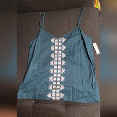 Old Navy Teal Tank Top With White Embroidery Down The Front Center. Navy Tank Top, Teal Tank Top, Strappy Tank Tops, Sequin Shirt, Spaghetti Strap Tank Top, Floral Denim, Yoga Tank Tops, Tunic Tank Tops, Floral Tank Top