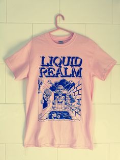 T-Shirt featuring the front cover artwork from the hit small press comic book by Samuel Hickson.  Blue ink screen printed on Gildan heavy pink T-shirt. Pink Tshirt Design Ideas, Pink Graffiti Print T-shirt For Streetwear, Pink Front Print T-shirt For Streetwear, Pink Graphic Print T-shirt For Streetwear, Pink Cotton T-shirt With Graffiti Print, Pink Top With Front Print For Fan Merchandise, Pink Pop Culture T-shirt With Screen Print, Pink Graphic Design Top For Fans, Pink Graphic Design T-shirt For Fan Merchandise