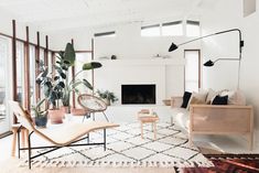 a living room filled with furniture and a fire place