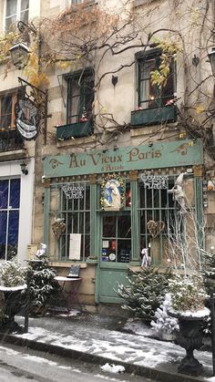 an old building with snow on the ground