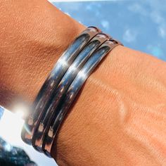 "Set of 3 - 6mm Silver Chunky Stacking Bangles. The perfect bracelet stack to dress up any look! How to determine your bangle size: 1.Make a fist 2.Measure the distance between the center of your far left knuckle to that of your far right. This will be your inner circumference minimum. Sizing 2.75\" inner diameter Material: Stainless Steel - We recommend keeping abrasive chemicals away from the jewelry for the items to last.   Thank you for visiting and supporting our small business! We hope you Affordable Silver Stainless Steel Bangle, Cheap Silver Stainless Steel Bangle, Cheap Stainless Steel Bangle Jewelry, Affordable Adjustable Stainless Steel Bangle, Perfect Bracelet Stack, Stacking Bangles, Womens Bangles, Bracelets Silver, Stacking Bracelets