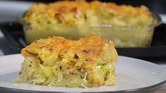 a close up of a plate of food with broccoli casserole in the background