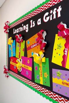 a bulletin board with colorful gift boxes on it's side and the words learning is a gift