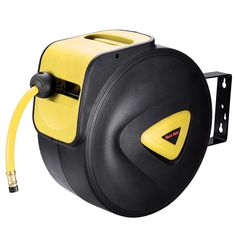 a yellow and black hose reel attached to a wall