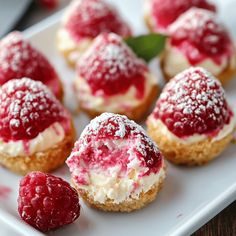 raspberry cheesecake bites on a white plate