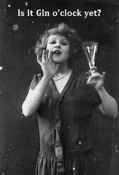 an old photo of a woman holding a glass in front of her face and making a silly face