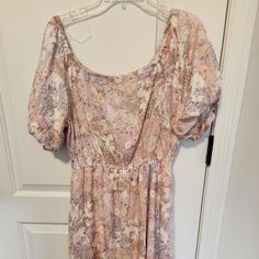 Dress Bought On Line At Prefectly Priscilla. Boutique In Georgia. Light Pink And Purple Flowers With Some Cream Accents. Brand New Never Warn. Elastic Around Sleeves Make Them Fluffy And Very Becoming. Back Has Some Elastic For Shape. Waist Has A Small Elastic Gathering To Help Flatter Waist. Dress Fits All Sizes. Size Shows Large Then 10/12 Sizing. Mauve Floral Print Midi Dress, Flowy Mauve Floral Print Dress, Mauve Floral Print Dress For Garden Party, Lavender Floral Print Short Sleeve Dress, Pink Tube Dress, Black Empire Waist Dress, Blush Sequin Dress, Long Sleeve Ruffle Dress, Abercrombie And Fitch Dresses