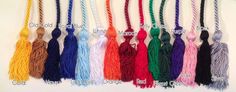 many different colored tassels are hanging on the wall