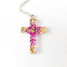 Сross necklace with pressed flowers in resin jewelry .  Simply lovely flower cross necklace with real pressed rink flower  and gold . This pendant made with real flowers and clear jewelry high-quality resin. Total length of approx: 1 inches Christian cross necklace: https://www.etsy.com/listing/552756206/cross-necklace-real-flowers-jewelry?ref=shop_home_active_61&pro=1&frs=1 https://www.etsy.com/listing/640326800/sross-from-real-flowers-in-resin-baptism?ref=shop_home_active_62&pro=1&frs=1 https: Spiritual Necklaces With Pressed Flowers As Gift, Spiritual Style Necklace With Pressed Flowers As A Gift, Pink Cross Necklace For Gifts, Pink Cross Pendant Jewelry As Gift, Pink Cross Necklace For Gift, Pink Cross Pendant Necklace For Gift, Pink Cross-shaped Jewelry Gift, Pink Cross-shaped Jewelry For Gift, Handmade Pink Cross Jewelry