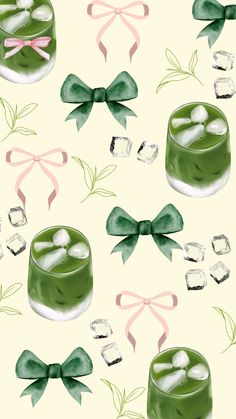 a green dessert with ice cubes and bows on it's sides is shown