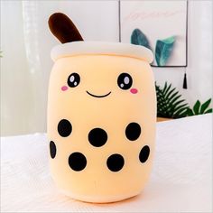 a white and black polka dot covered container on a table