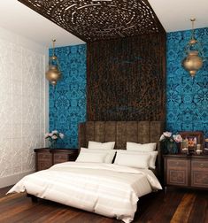 a bedroom with blue wallpaper and white bedding, wooden flooring and two lamps