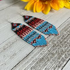 Native American Themed Seed Beaded Earrings Handmade Earrings Fringe Chevron Handmade Seed Beaded Fringe Earrings Made With 925 Sterling Silver Ear Hook And Glass Seed Beads. Native American Themed Colors - Black, Red, Tan, Blue, White Measurements Drop Length - 4 Inches Length With Ear Hook - 4.5 Inches Width - 1 Inch Care Instructions - To Maintain The Brightness Do Not Wear Them In Water. Made When Ordered Ships Within 2 Business Days Red White And Blue Beaded Earrings, Beaded Hoop Earrings Native American, Seed Beaded Earrings, Turquoise Gemstone Earrings, Earrings Patterns, Beaded Fringe Earrings, Native American Beaded Earrings, Hoop Earrings Style, Handmade Earrings Beaded