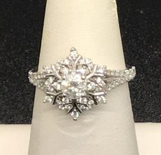 a diamond ring sitting on top of a white napkin